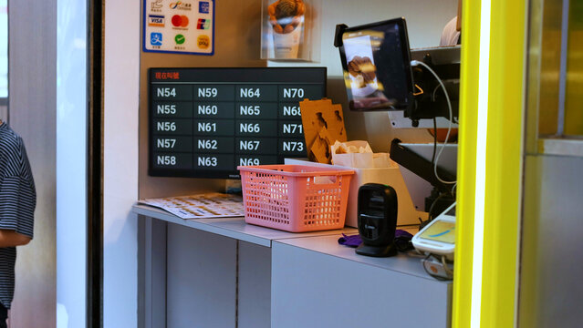 Digital Queue Management Display at a Service Counter in Hong Kong