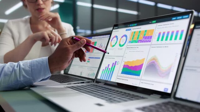 Data Analysts Reviewing Financial Dashboard