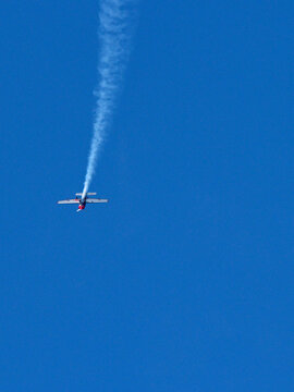 Stunt Plane Performing Aerobatics with Smoke Trail at Pacific Airshow Gold Coast