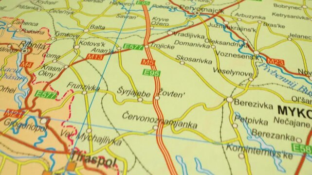 gliding over atlas map toward odesa,ukraine