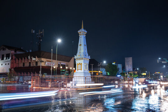 Iconic Tugu Jogja Monument at Night with Traffic Light Trails