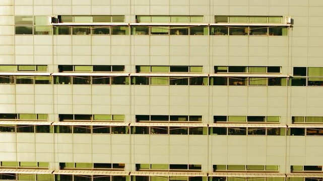Warm dusk light, repeating facade patterns on Latvia iconic library building