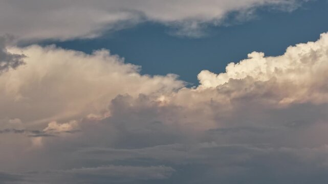 4k drone timelapse close-up study capturing the intense textures and rapid expansion of a massive pyrocumulus cloud. Towering, cauliflower-like columns of rising vapor billow with powerful force.