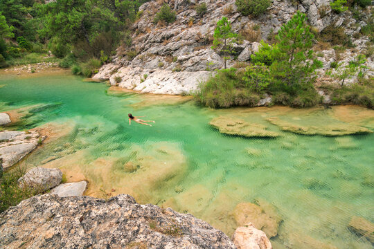 Swimming in the Crystal-Clear Waters of Las Pesqueras, Beceite, Teruel, Spain