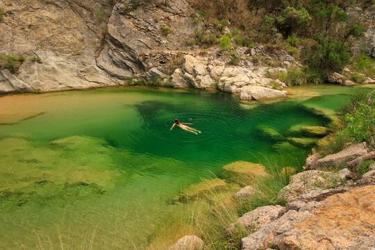 Swimming in the Crystal-Clear Waters of Las Pesqueras, Beceite, Teruel, Spain