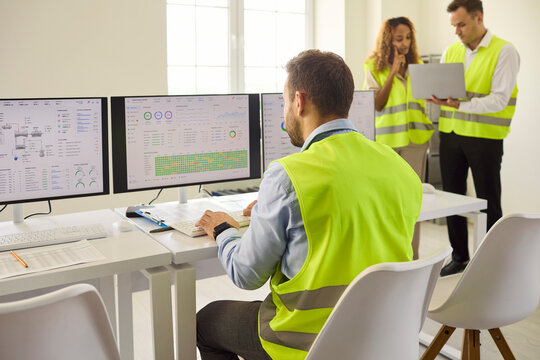Engineers team in controlroom monitors operations data. Teams ensure safety with real time monitoring on multiple screens using technology and analysis. Clear concept of safety and control.