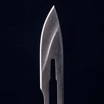 Medical Titanium Surgical Scalpel Blade Reflection Isolated Black