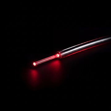 Fiber Optic Cable Glowing Red Laser Tip Isolated Black in Studio