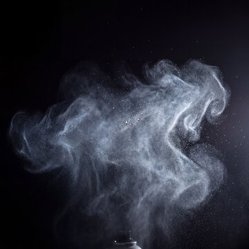 Fine Aerosol Spray Mist Cloud Backlit Isolated Black in Studio