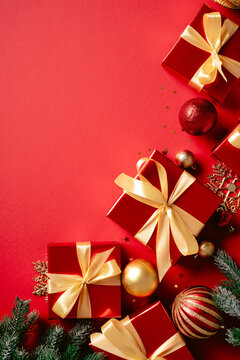 Red Christmas gift boxes side border vertical on red background