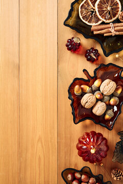 Autumn leaf glass dishes side border on wooden table vertical orientation