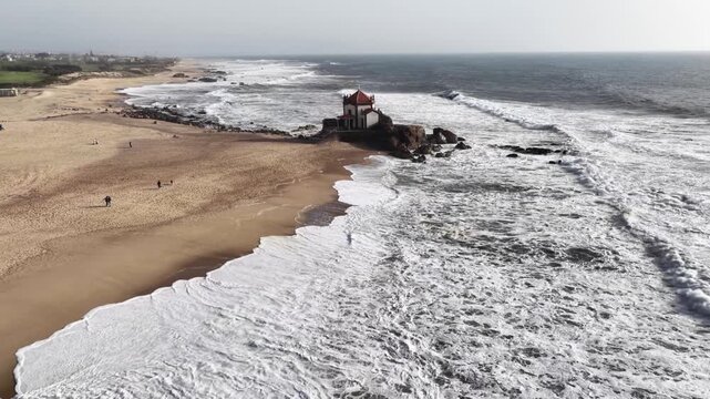 Capela do Senhor da Pedra at Miramar Beach during a sunny day in Porto Portugal