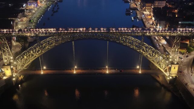 Luis I Bridge shines over the Douro River in Porto at night
