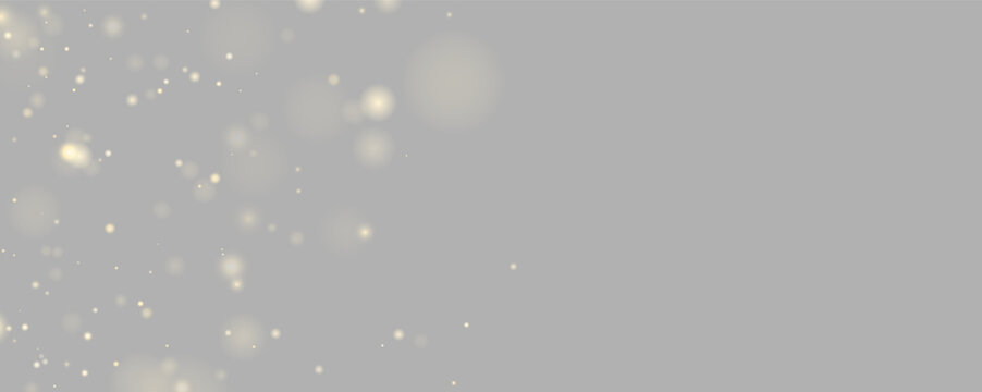 Clusters of soft golden bokeh lights scattered against a deep black background. The lights vary in size and intensity, creating a dreamy and diffuse effect.