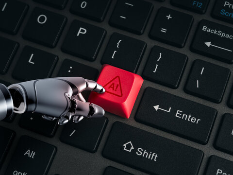 Robotic hand presses a red AI warning key on a computer keyboard background, illustrating artificial intelligence risk, algorithmic failure, governance, oversight and technology safety concept.