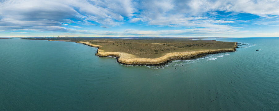 Panoramic aerial view on the rocky Atlantic cliff coast of Argentina in the vicinity of the city of Puerto San Julian
