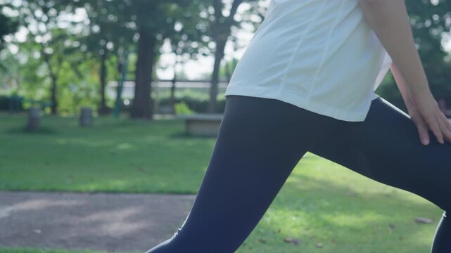 health care female exert on the park. Asian woman doing exercises in morning. balance, recreation, relaxation, calm, good health, happy, relax, healthy lifestyle, reduce stress, peaceful, Attitude.