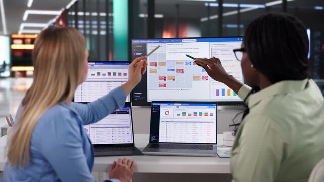 Environmental Safety Manager Reviews Incident Reports On Laptop