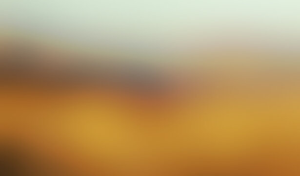 Abstract warm gradient background with smooth blurred light transition from soft gold to grey for modern minimal design