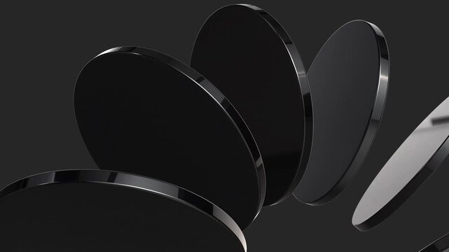 Abstract 3D motion of rotating black glossy discs