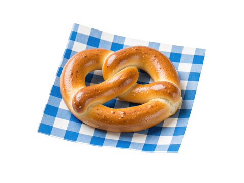 Bavarian pretzel on a blue and white checked napkin, isolated on transparent background