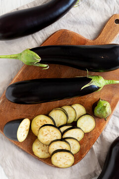 Raw Organic Eggplant on a Wooden Board