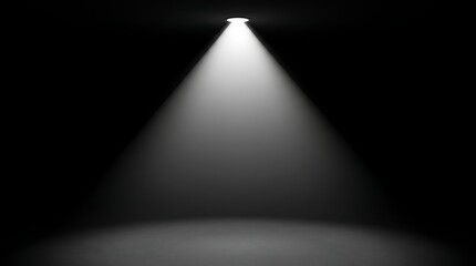 Obraz premium Dramatic spotlight beam illuminating dark stage for performance or presentation setup