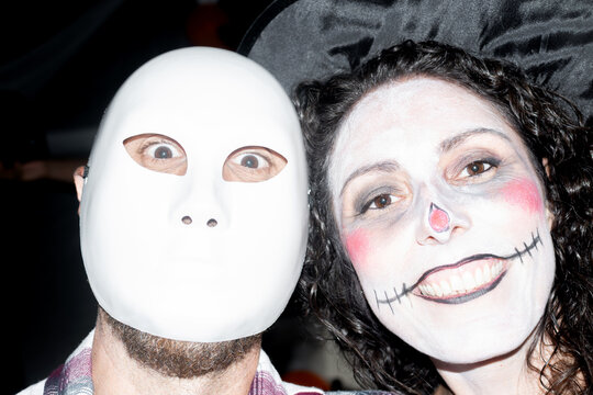 Friends posing in spooky costumes at Halloween party