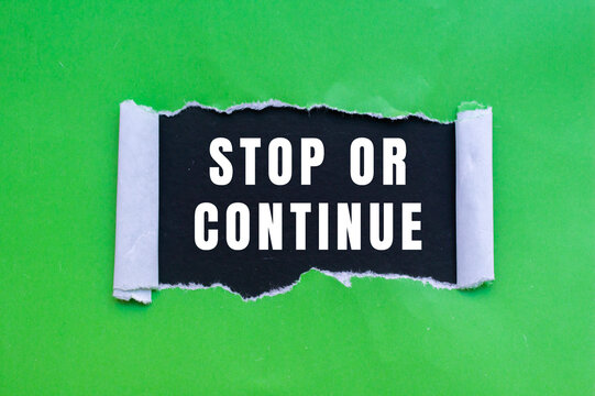 Stop or Continue text concept photo