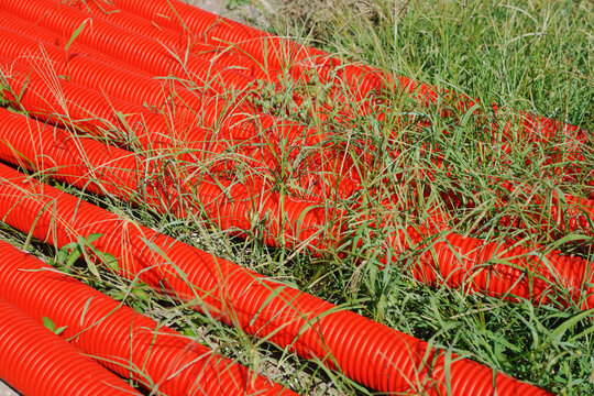 Close-Up View of Red Flexible Corrugated Cable Conduits