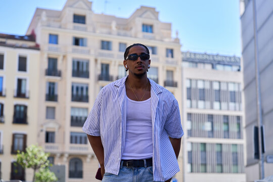 Young man posing confident in urban street style
