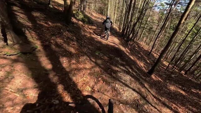 Slow Motion POV Mountain Biker Shadow and Wheel Following Rider 
