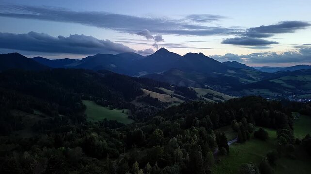 Aerial Hyperlapse Moving Forward Over Dark Mountain Forest After Sunset