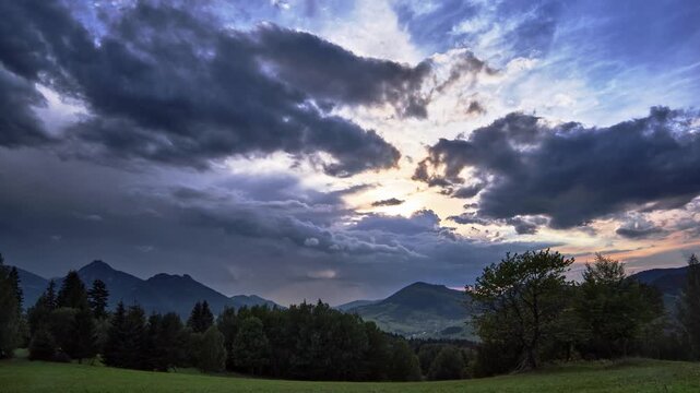Timelapse of Dramatic Sky and Distant Rain Shower Over Mountain Hills