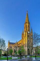Naklejka premium Cathedral of the Good Shepherd in San Sebastian, Spain. Three quarter exterior view. Sunny daylight, blue sky. Neo Gothic