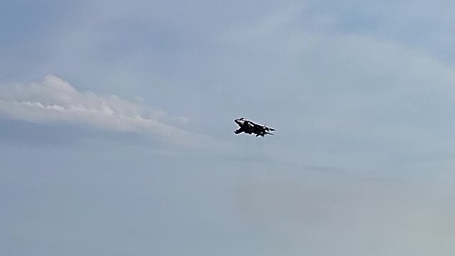 Sea Harrier fighter in a hover. AV-8B Harrier II. V-STOL. Armed fighter flying at low altitude. Spain.