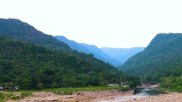 Aerial landscape of Khasi Hills and dry Piyain River near Bangladesh India border - aerial panning shot.
