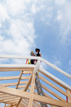 Europe, Germany, Rhineland Palatinate, Man celebrating topping out ceremony