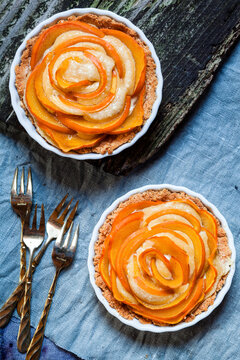Two almond pies with kaki slices