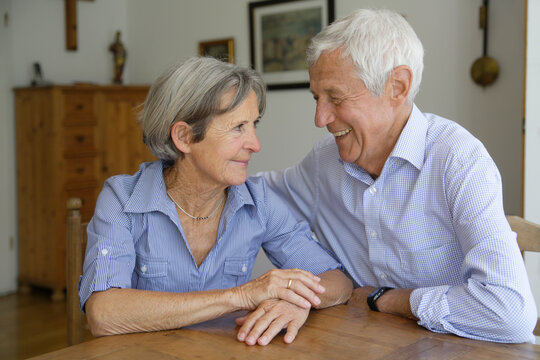 Germany, Bavaria, Senior couple looking at each other, smiling