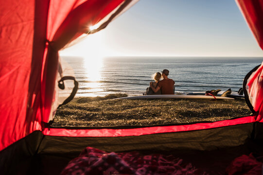 Young couple in love camping at seaside