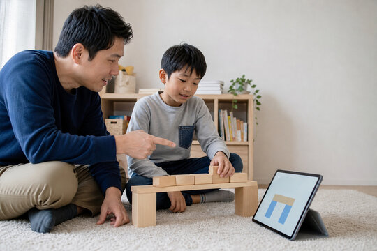 Japanese Child Balances Tablet Learning and Block Play
