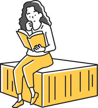 座って本を読む女性
