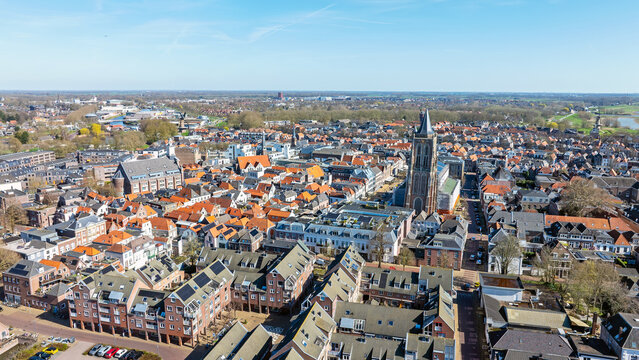 Overview of a historic Dutch city with church tower in Europe