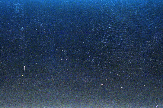 Blank grained film strip texture background with heavy grain, dust and light leak