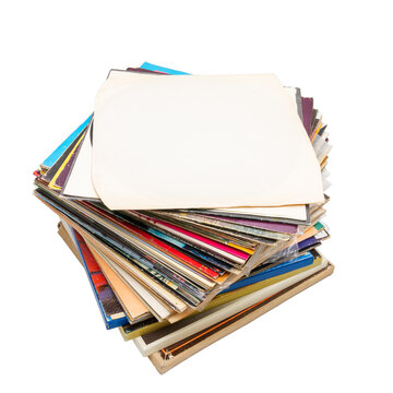 Stack of vintage vinyl records isolated on white background. Collection of old music LPs. Pile of vintage music media.