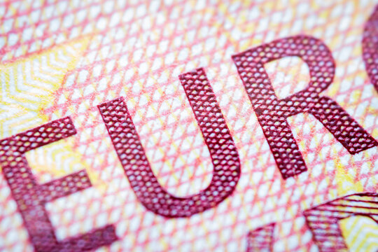 Euro currency extreme close up of 10 euro banknote. Detailed European money texture. Selective focus. Shallow depth of field. Extreme macro.