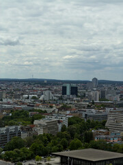 Fototapeta premium City skyline with modern office tower skyscraper under overcast cloudy sky