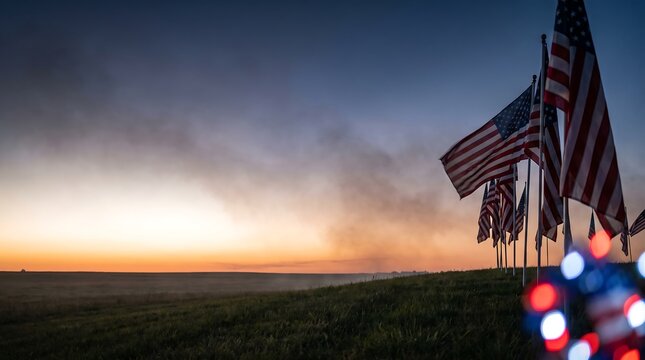 A row of american flags waving during a beautiful sunset to honor fallen soldiers on the solemn memorial day holiday observance