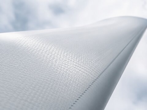 Macro close-up of wind turbine blade composite fiberglass surface texture